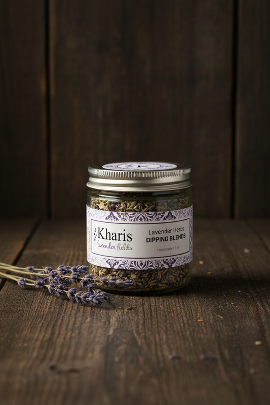 Kharis Lavender Fields Lavender Herbs Dipping Blends glass jar with silver lid on a dark wood surface with dried lavender sprigs
